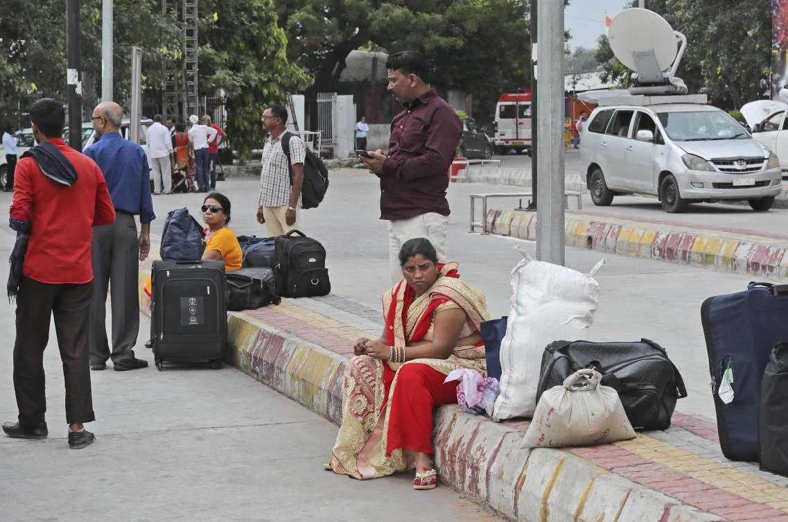 Passengers wait for transportation during a public transport strike in New Delhi, India, Thursday, Sept. 19, 2019. (AP)
