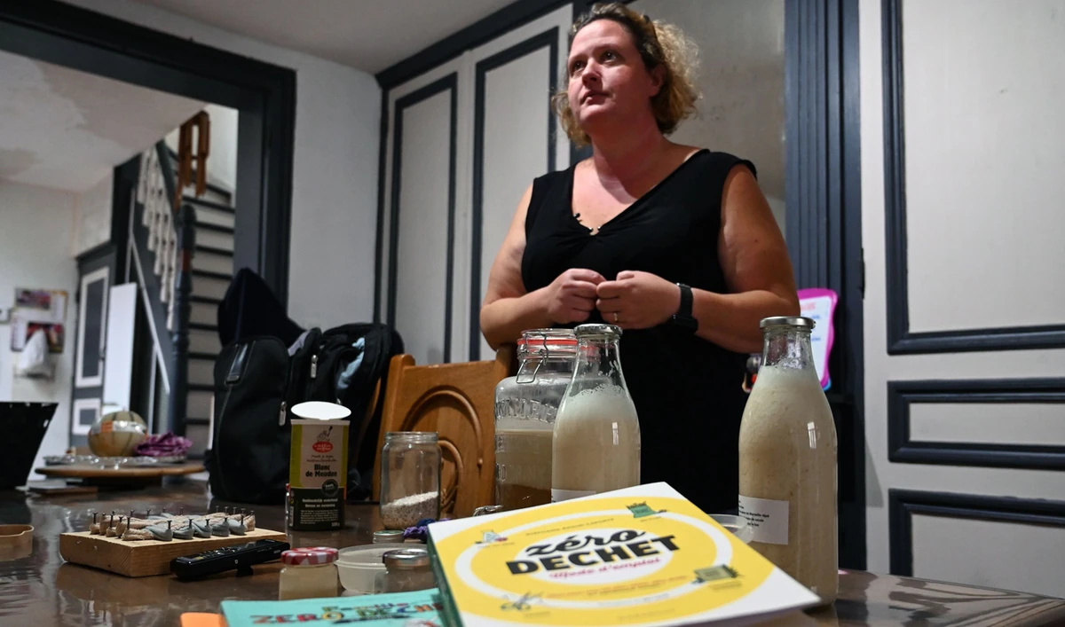 Magdalene Deleporte explains how she manufactures her household products and hygiene articles, in Roubaix, northern France, on September 16, 2019. (AFP)