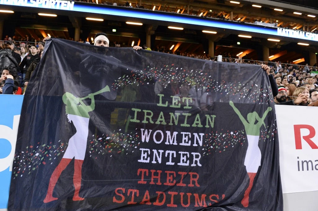 Supporters hold a banner reading ‘Let Iranian women enter their stadiums’ during the football match between Sweden and Iran at the Friends Arena in Solna near Stockholm in this March 31, 2015 file photo. (AFP)