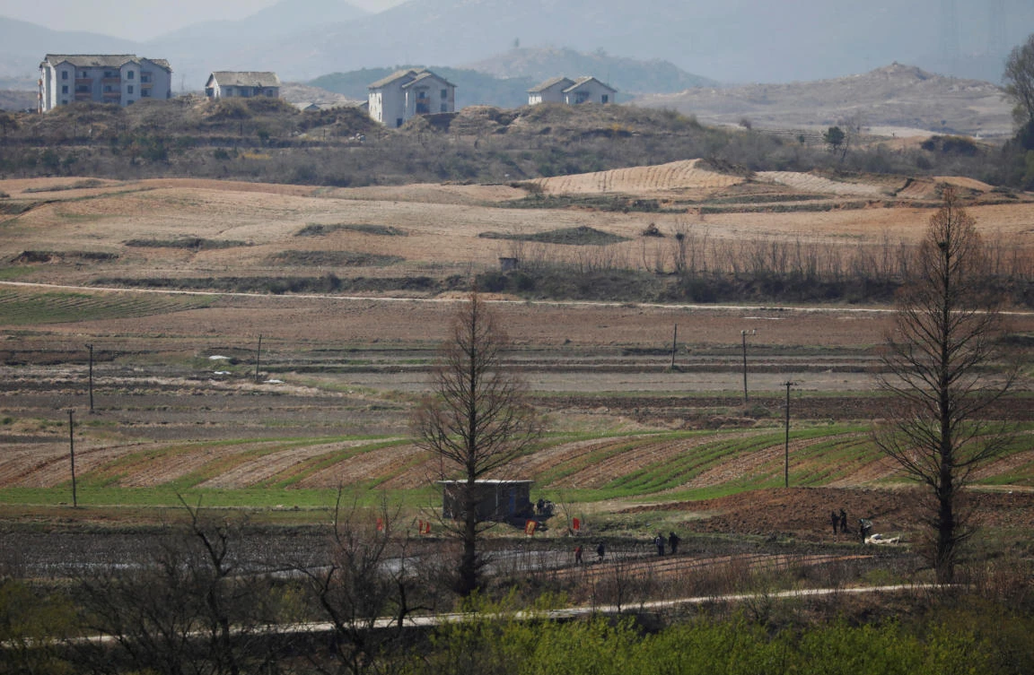 North Korean people work on a rice field at the propaganda village of Gijungdong in North Korea in this April 11, 2018 picture. (Reuters)