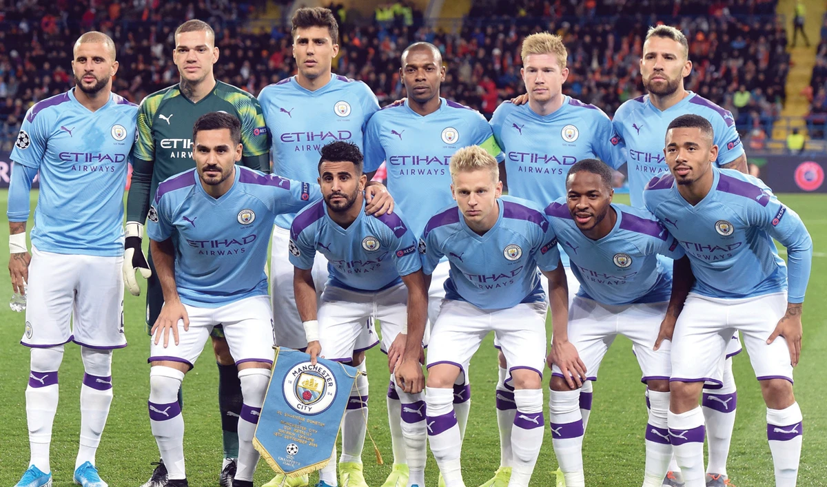 Manchester City’s players pose for a group photo before their match against FC Shakhtar Donetsk in Kharkiv on Wednesday. (AFP)