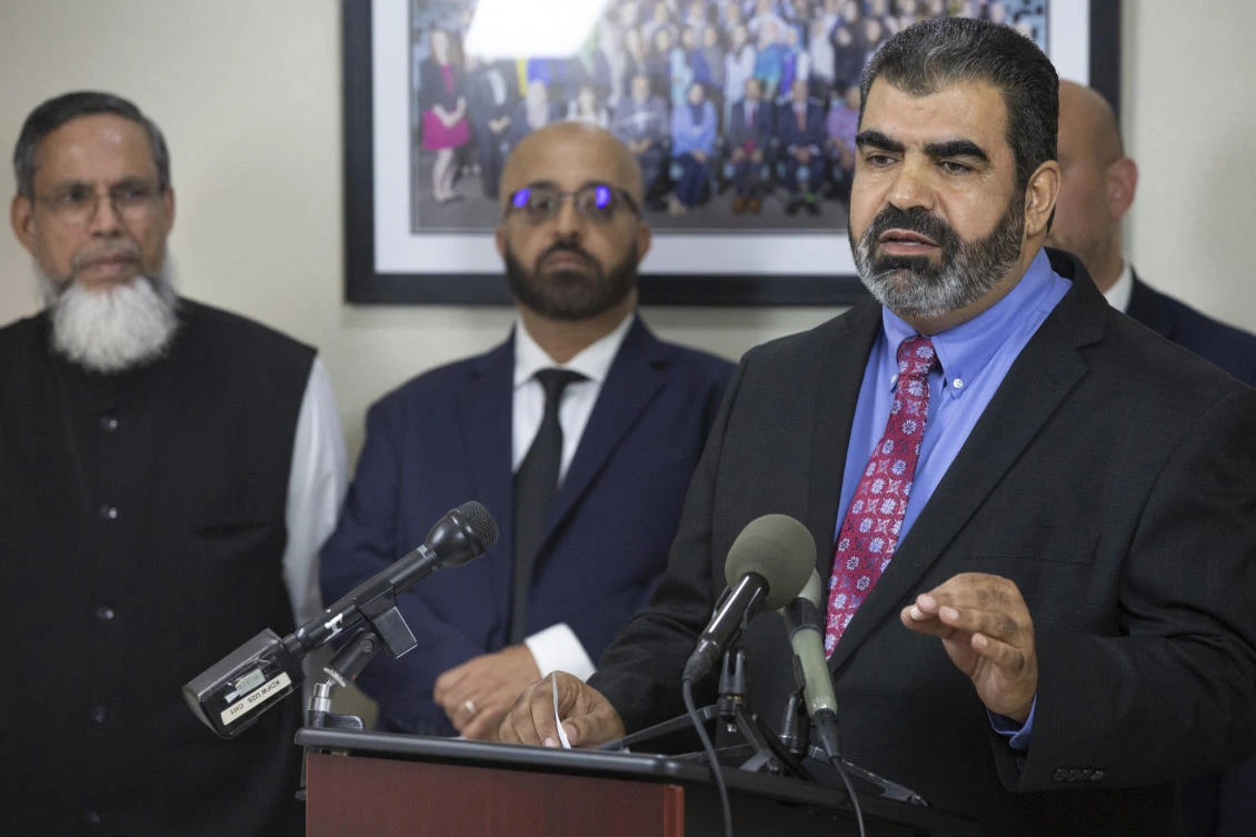 Abderraoof Alkhawaldeh, right, and Issam Abdallah, second from left, who are both Muslim, say they were profiled and discriminated against during a recent American Airlines flight in Alabama. (The Dallas Morning News via AP)