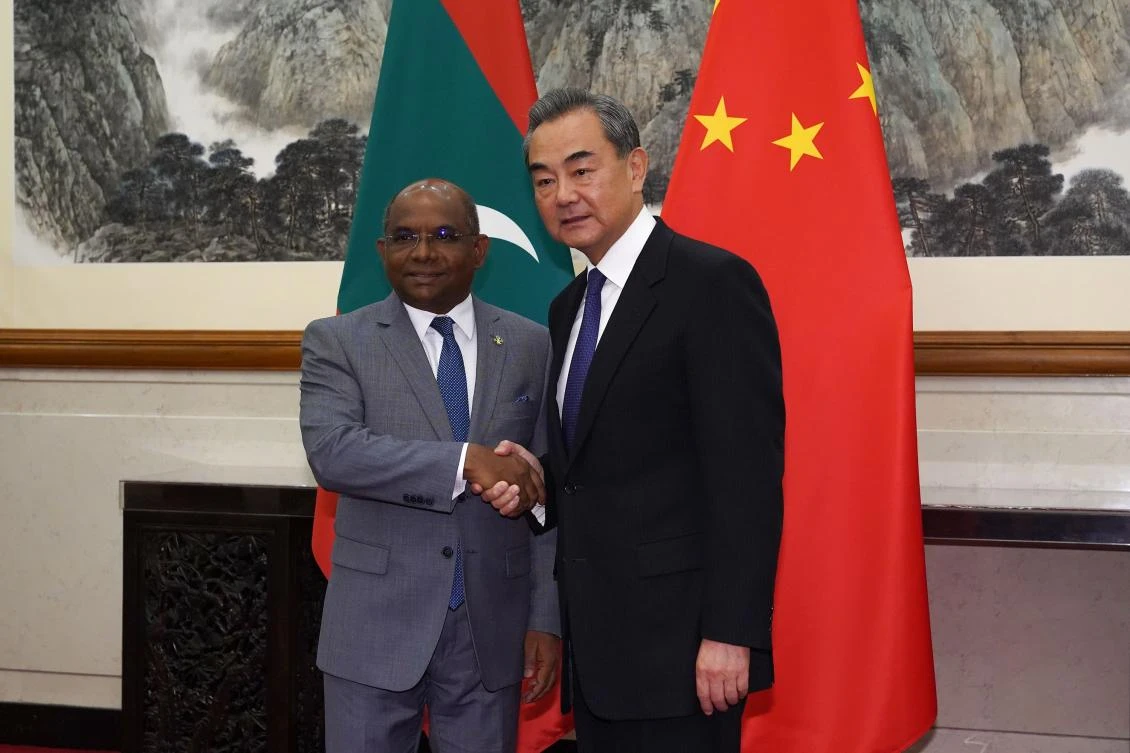 Chinese Foreign Minister Wang Yi shakes hands with Maldives Foreign Minister Abdulla Shahid at the Diaoyutai State Guesthouse in Beijing on September 20, 2019. (File/AFP)