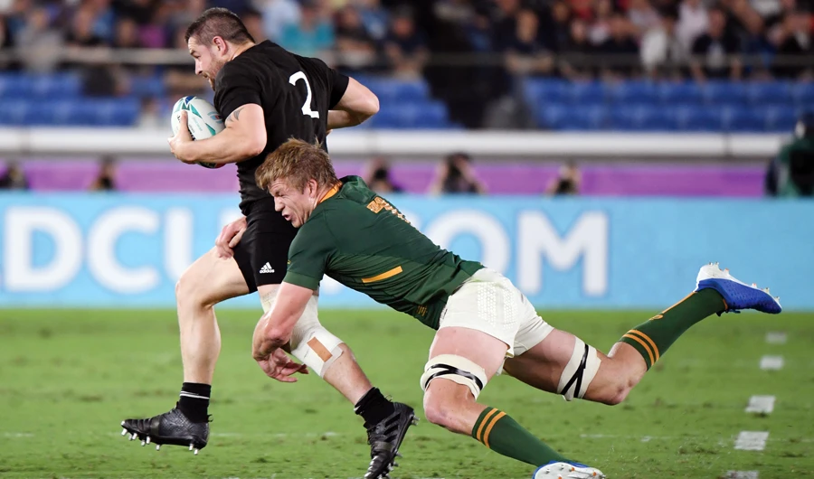South Africa’s flanker Pieter-Steph Du Toit tackles New Zealand’s hooker Dane Coles during Saturday’s match in Yokohama. (AFP)