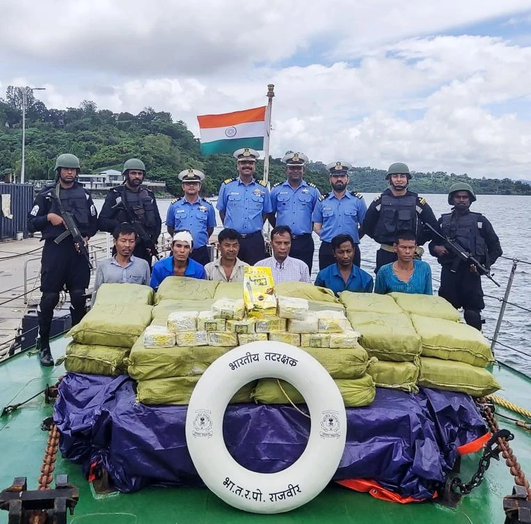 Indian Coast Guard personnel keep watch on a Myanmarese ship’s crew after seizing 1,160 kilograms of Ketamine drug from their boat near Car Nicobar islands. (India’s Ministry of Defense/AFP)