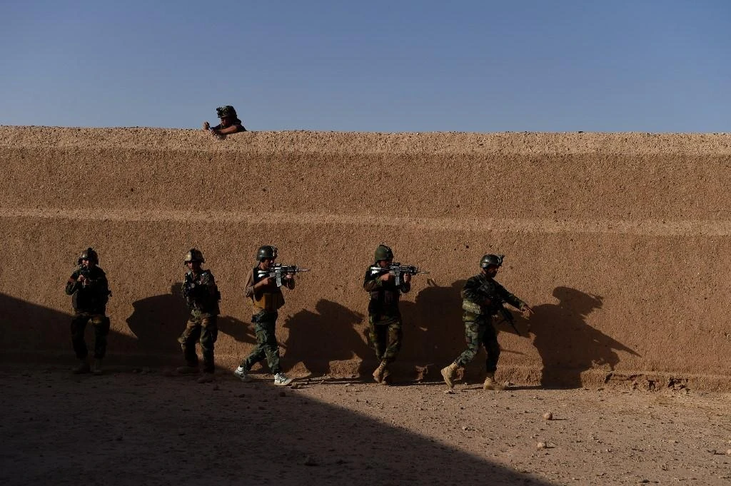 Commandos take positions during a combat training exercise at the Shorab Military Camp the Afghan province of Helmand in this August 27, 2017 file photo. (AFP)