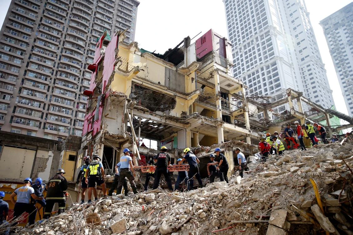 Rescue efforts are still ongoing to free another victim after one of the workers was retrieved after almost six hours following the incident. (AP Photo)