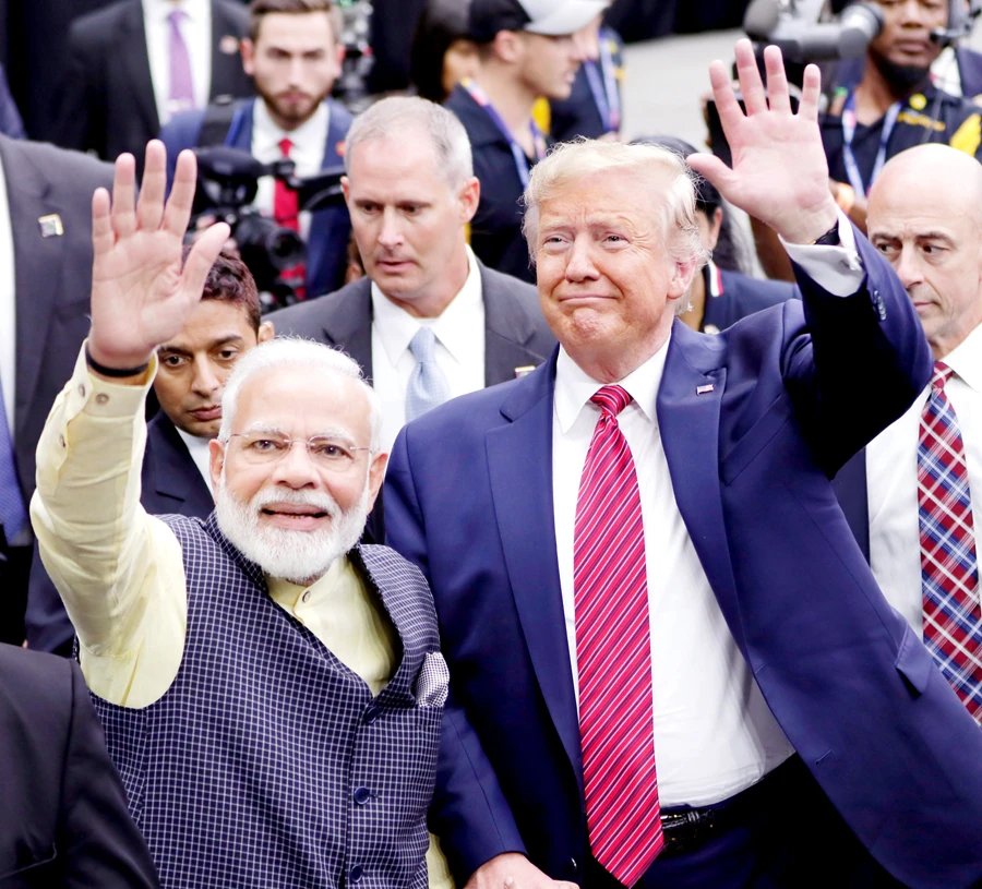 Indian Prime Minister Narendra Modi and US President Donald Trump wave to participants at rally in Houston’s NRG stadium on Sunday. (AP)