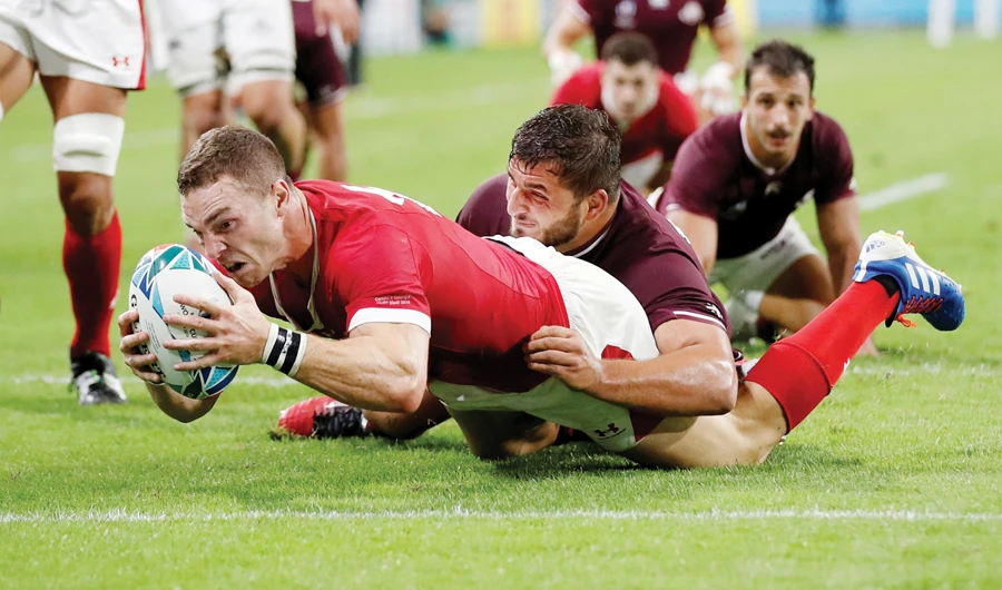 Wales’ George North scores their sixth try against Georgia. (Reuters)