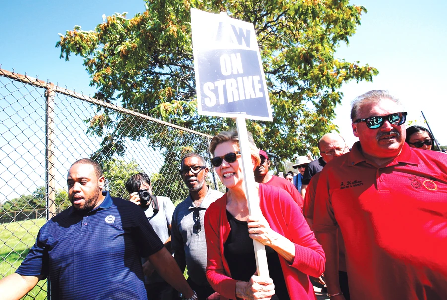 US presidential candidate Sen. Elizabeth Warren attends the picket line with striking General Motors workers in Hamtramck, Michigan. (Reuters)