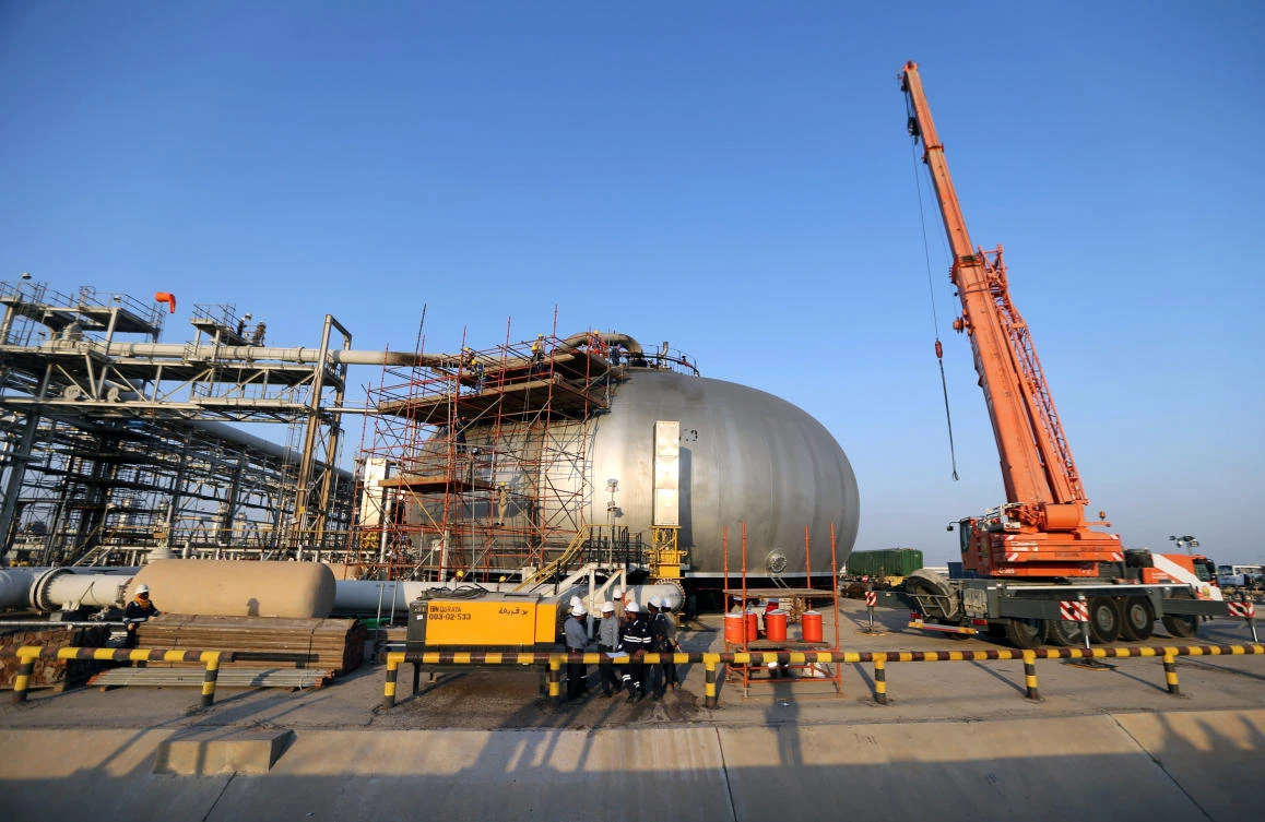 Workers start clearing up the damaged facilities at Saudi Aramco’s site in Abqaiq. (Reuters)