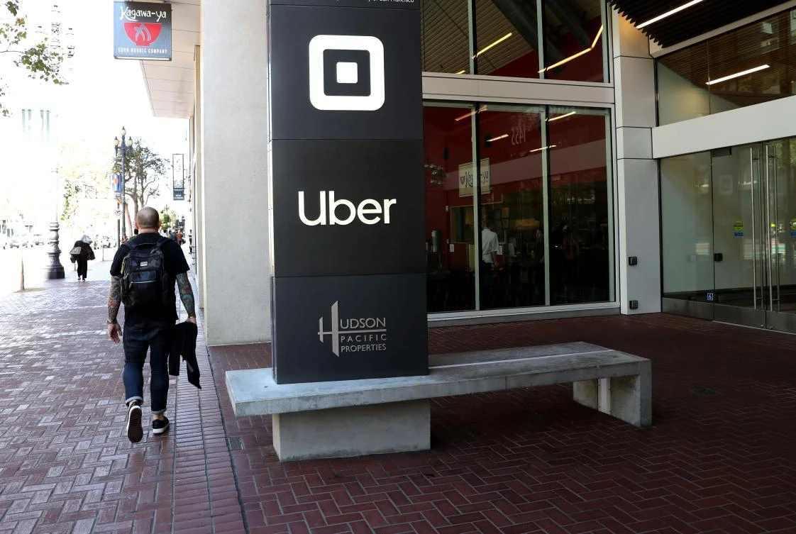 A pedestrian walks by Uber headquarters on September 23, 2019 in San Francisco, California. (File/AFP)