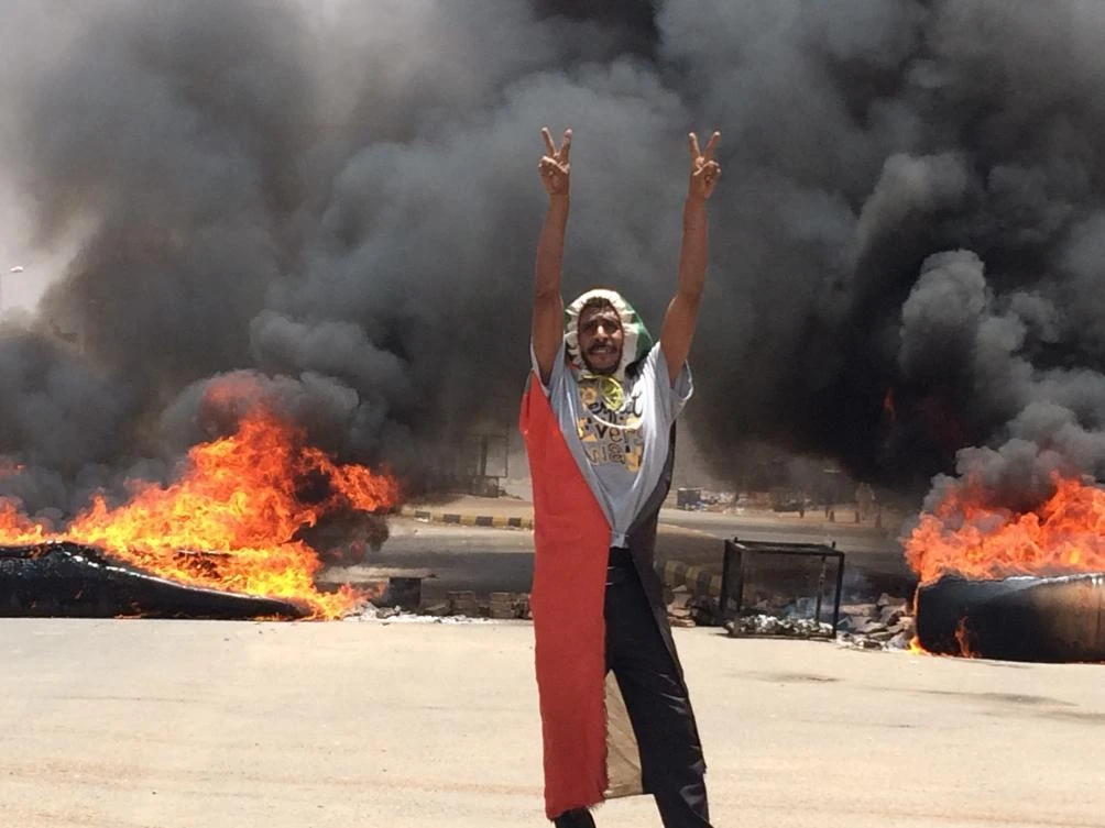 In this June 3, 2019 file photo, a protester flashes the victory sign near the army headquarters, in Khartoum, Sudan. (AP)