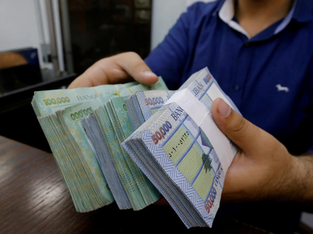 A money exchange vendor displays Lebanese pound banknotes at his shop in Beirut, Lebanon, November 8, 2017. (Reuters)