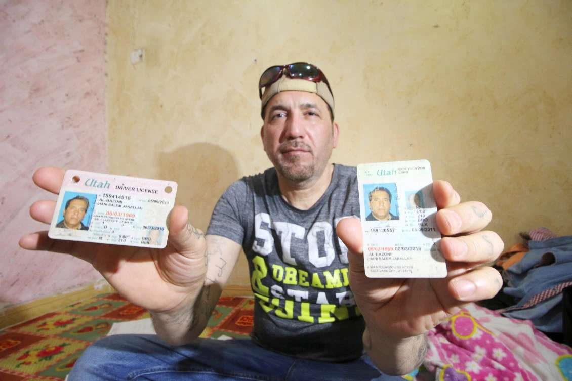 Hani al-Bazoni, who was deported from the United States to Iraq under U.S. President Donald Trump's strengthened immigration enforcement, shows his ID during an interview with Reuters at his home in Basra, Iraq August 19, 2019. (Reuters)