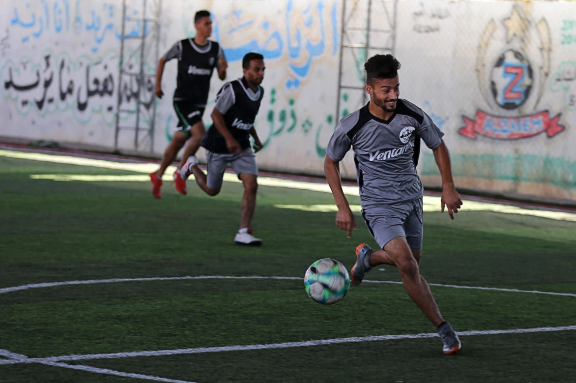 Palestinian players of Gaza football club Khadamat Rafah take part in a training session in Rafah in the southern Gaza Strip September 24, 2019. Picture taken September 24, 2019. (Reuters)