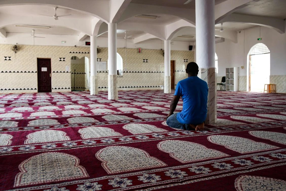 A man prays in a room of the mosque of Tsingoni, on the French island of Mayotte on September 14, 2019. (AFP)