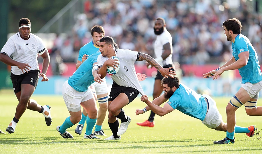 Fiji’s Josh Matavesi is tackled by Uruguay’s Santiago Civetta during their Rugby World Cup match on Wednesday. (Reuters)