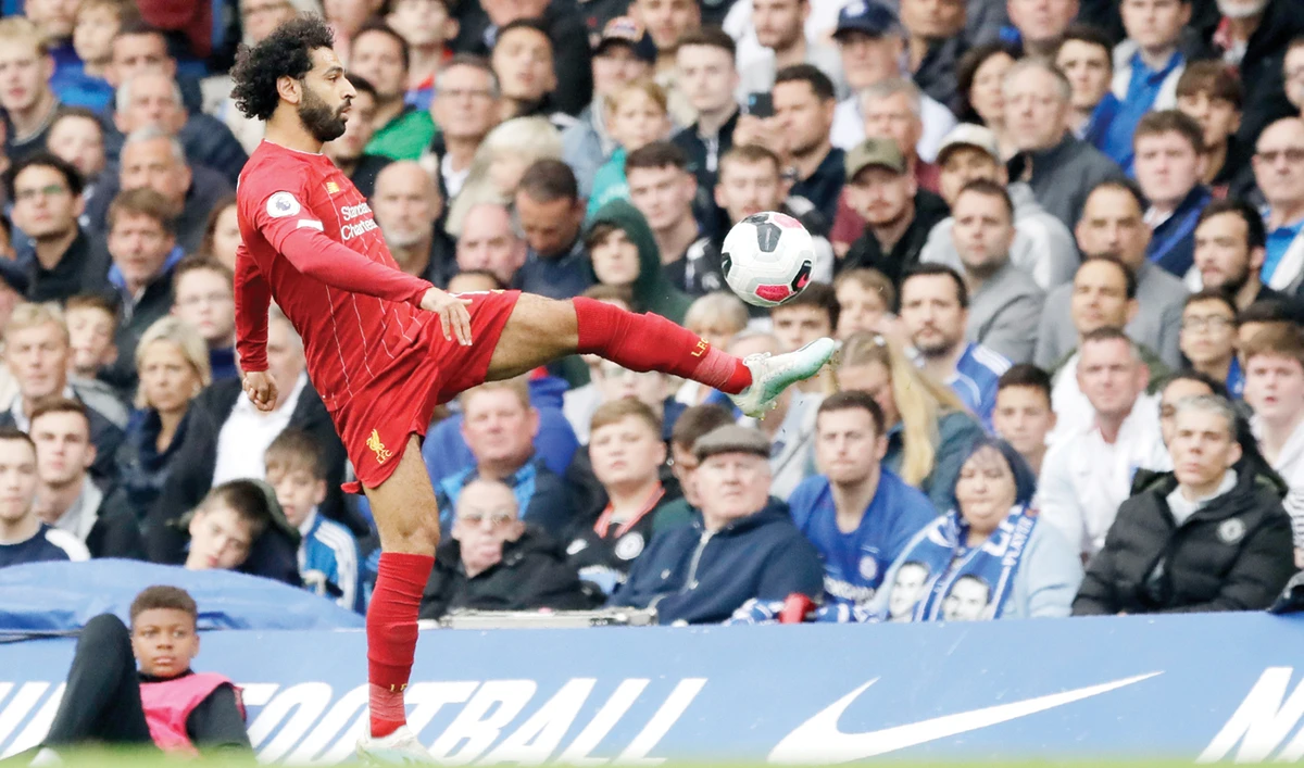 Liverpool’s Mohamed Salah kicks the ball during the British Premier League match between Chelsea and Liverpool in London. (AP)