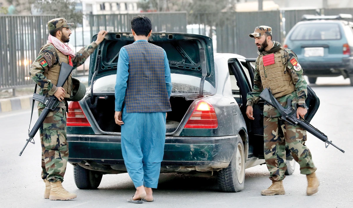 Afghan National Army soldiers search a vehicle at a checkpoint in Kabul ahead of presidential elections scheduled for Saturday. (AP)