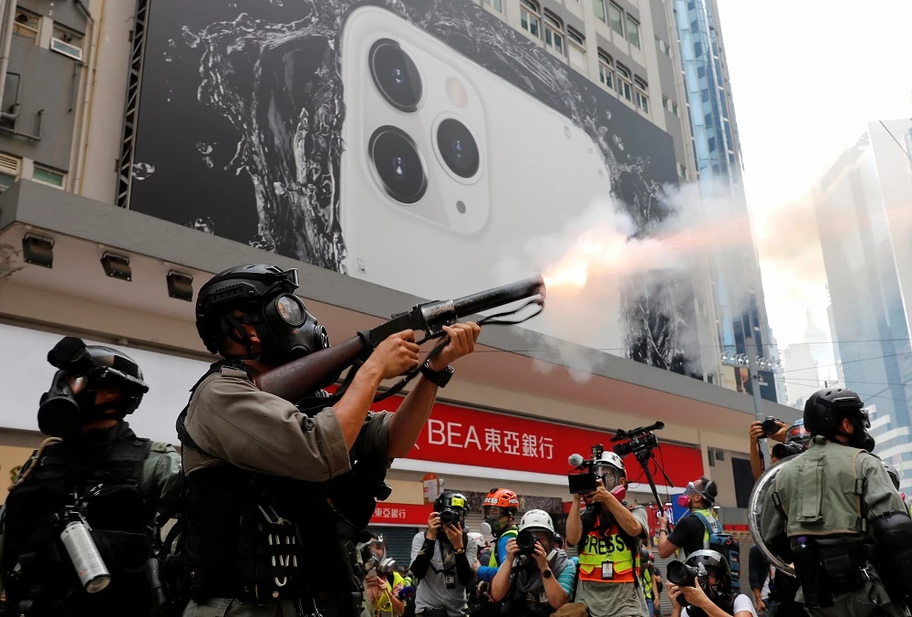 Hong Kong police fire tear gas to break up protesters