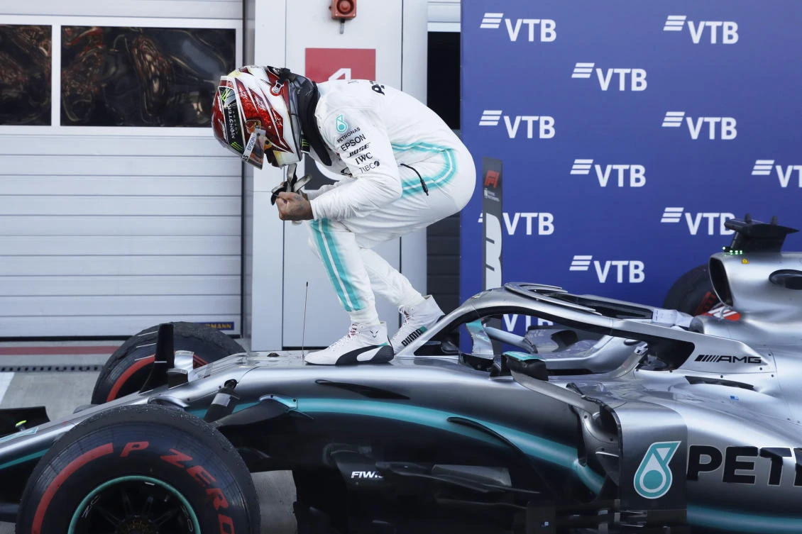 Mercedes driver Lewis Hamilton of Britain celebrates after winning the Russian Formula one Grand Prix, at the 'Sochi Autodrom' Formula One circuit, in Sochi, Russia, Sunday. (AP)