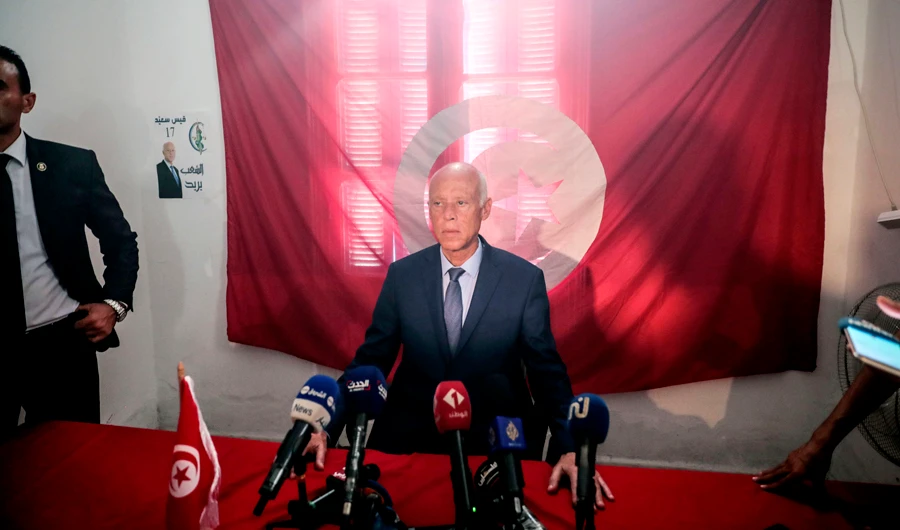 Tunisia’s presidential vote pits professor vs. prisoner