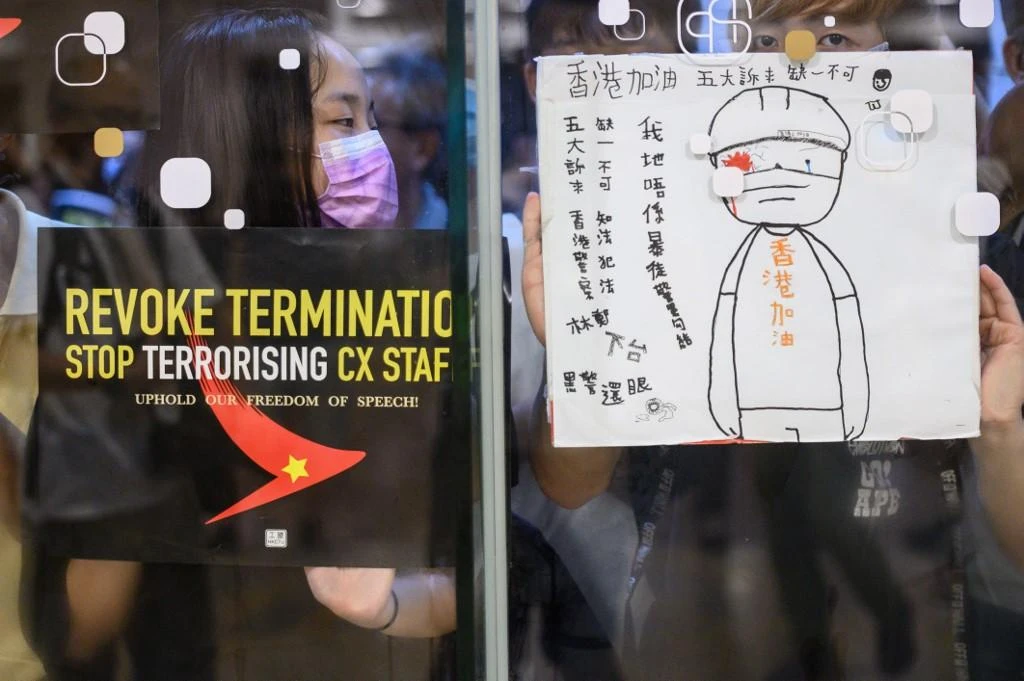 Protesters stick posters outside a shopping mall in a rally to support Cathay Pacific staff in Hong Kong in this August 28, 2019 file photo. (AFP)