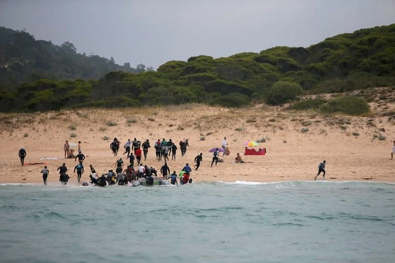 Migrants disembark from a dinghy on Del Canuelo beach after they crossed the Strait of Gibraltar sailing from the coast of Morocco, in Tarifa, southern Spain, July 27, 2018.(Reuters)