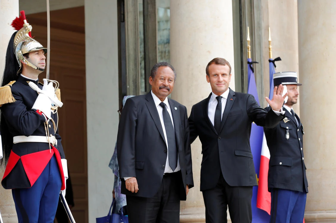 French President Emmanuel Macron welcomes Sudan's Prime Minister Abdalla Hamdok as he arrives for a meeting at the Elysee Palace in Paris, France, September 30, 2019. (Reuters)