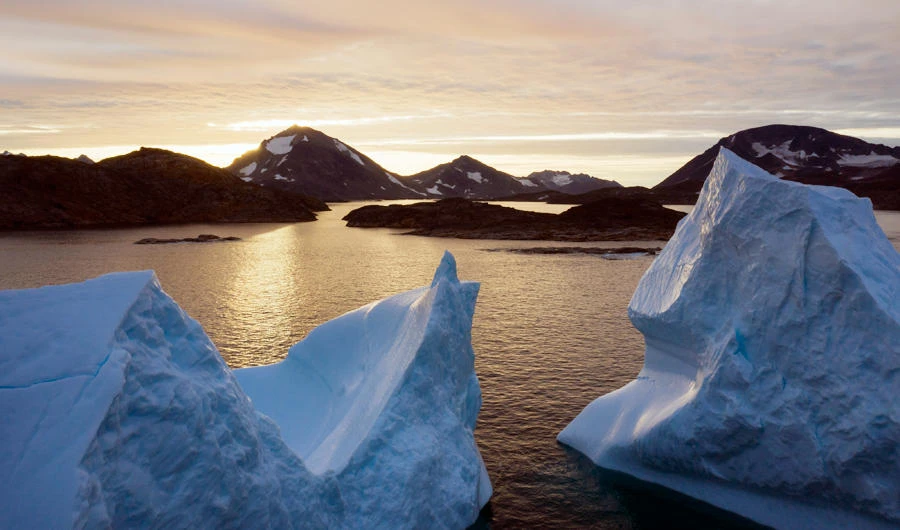 This early Friday, Aug. 16, 2019 file photo shows an aerial view of large Icebergs floating as the sun rises near Kulusuk, Greenland. (AP)