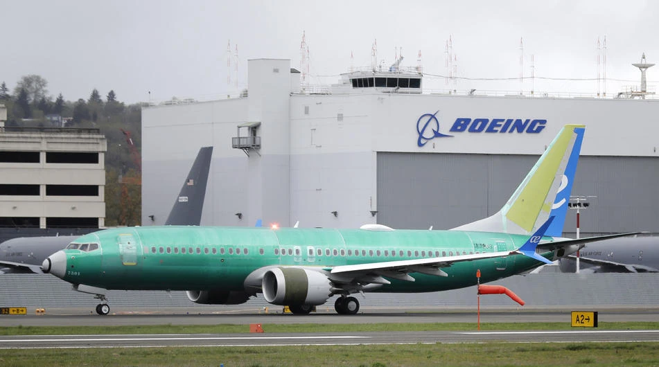 In this April 10, 2019, file photo a Boeing 737 MAX 8 airplane rolls toward takeoff before a test flight at Boeing Field in Seattle. (AP Photo/Ted S. Warren, File)