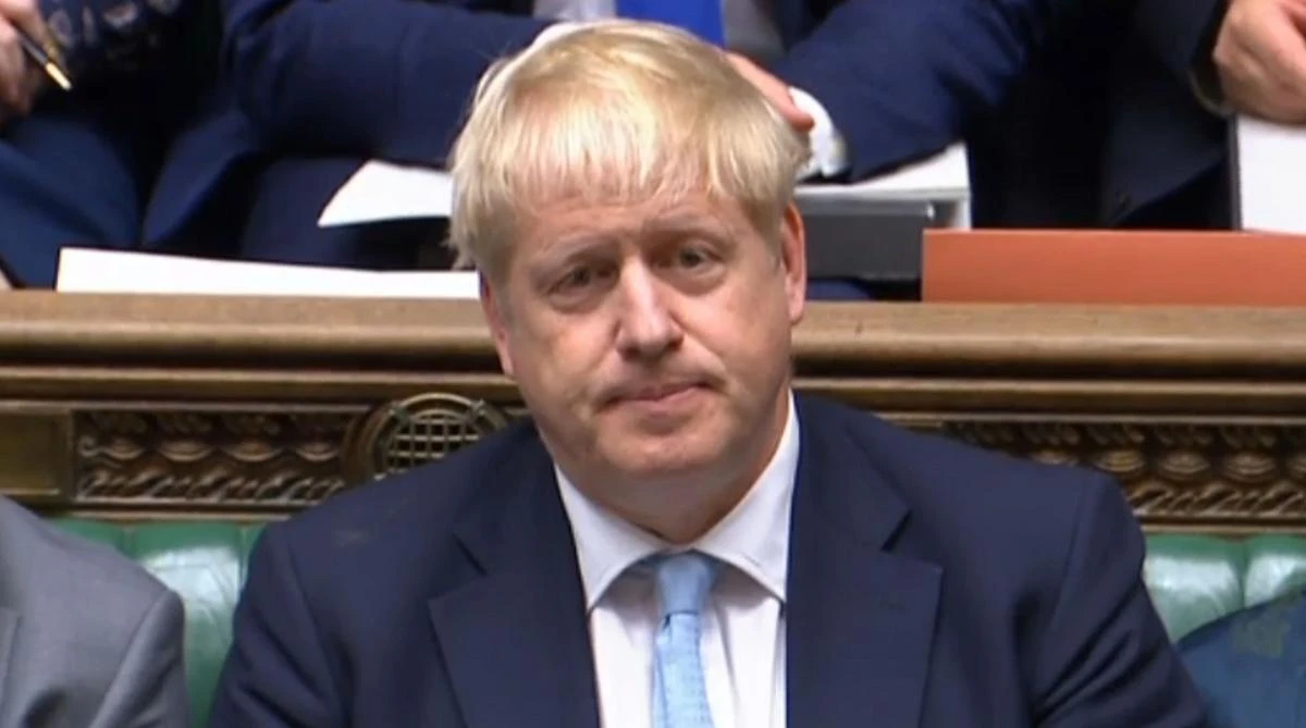 A video grab from footage broadcast by the UK Parliament's Parliamentary Recording Unit (PRU) shows Britain's PM Boris Johnson listening to the questions of Labour leader Jeremy Corbyn in the House of Commons on October 3, 2019. (AFP)