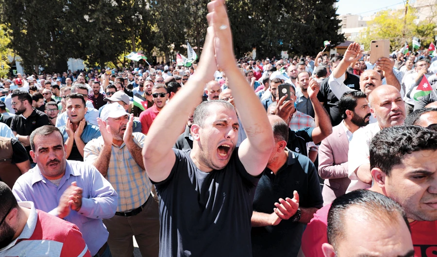 A public school teacher takes part in a protest as part of strike in Amman, Jordan, on Thursday. (Reuters)
