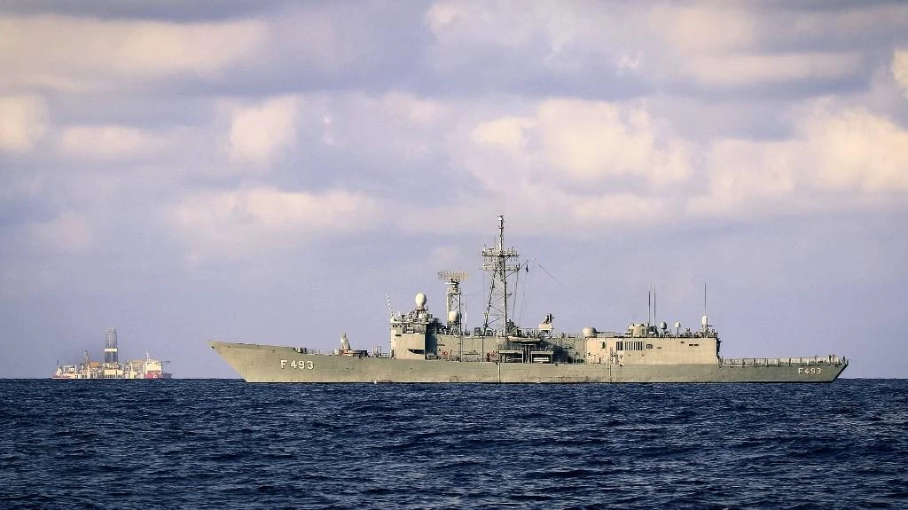 The Turkish army frigate Gelibolu, right, and the drilling vessel Fatih, left, which was deployed to search for gas and oil in waters considered part of the EU state’s exclusive economic zone maneuver in the Mediterranean Sea, off the coast of Cyprus in this September 25, 2019 photo. (AFP)