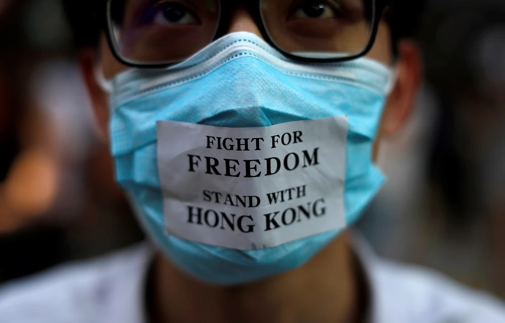 Hong Kong’s ban on face masks would take effect on Saturday under colonial-era emergency powers invoked for the first time in more than 50 years. (AFP)