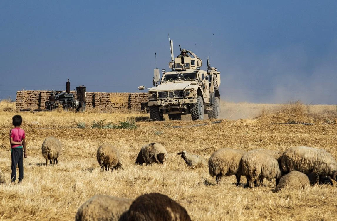A US military vehicle takes part in joint patrol with Turkish forces in the Syrian village of al-Hashisha on the outskirts of Tal Abyad town along the border with Turkey, on October 4, 2019. (AFP)