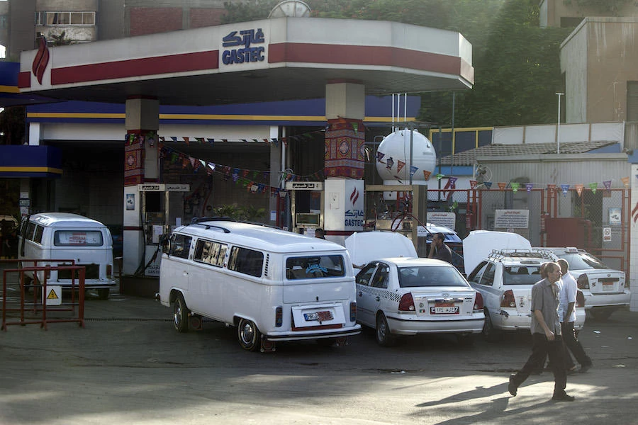 Egyptians gather at a petrol station. (File/AFP)