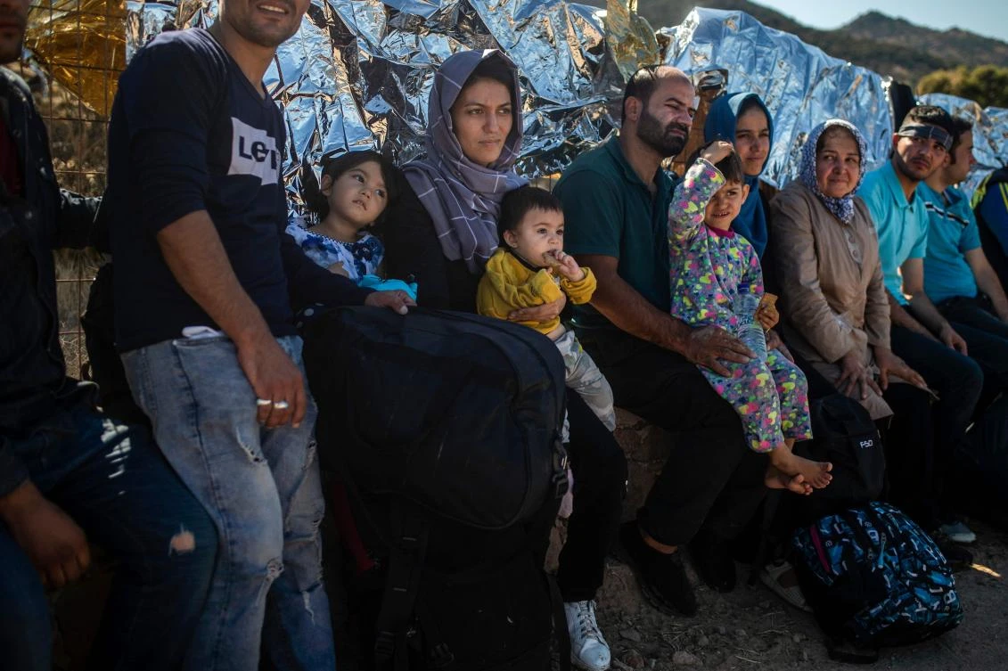 Migrants rest on the Greek Mediterranean island of Lesbo after crossing the Aegean Sea from Turkey in a dinghy (File/AFP).