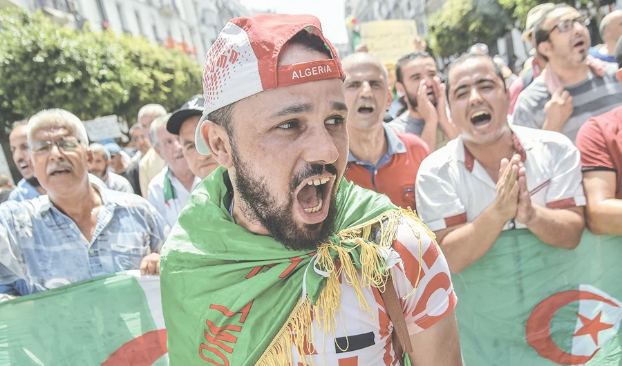 An Algerian takes part in a demonstration against the ruling class in the capital Algiers. (AFP)