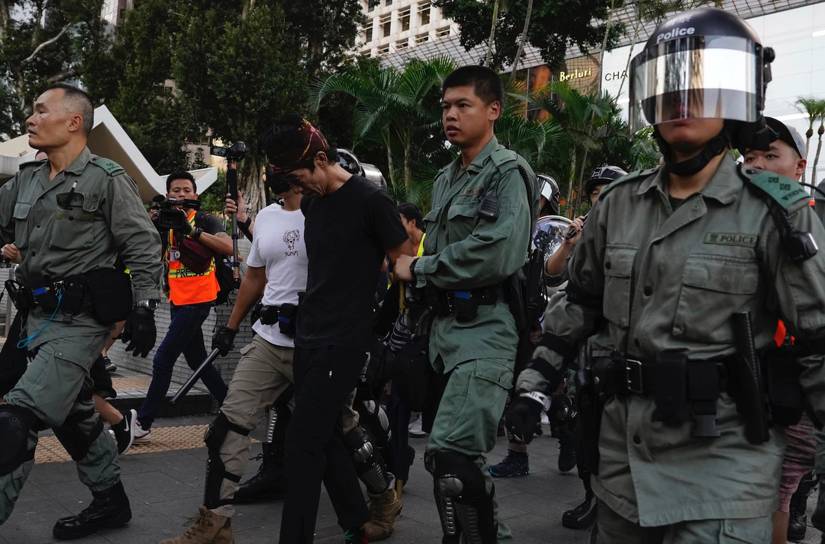 Hong Kong police detain a man on the streets of Hong Kong on Saturday, Oct. 5, 2019. (AP)