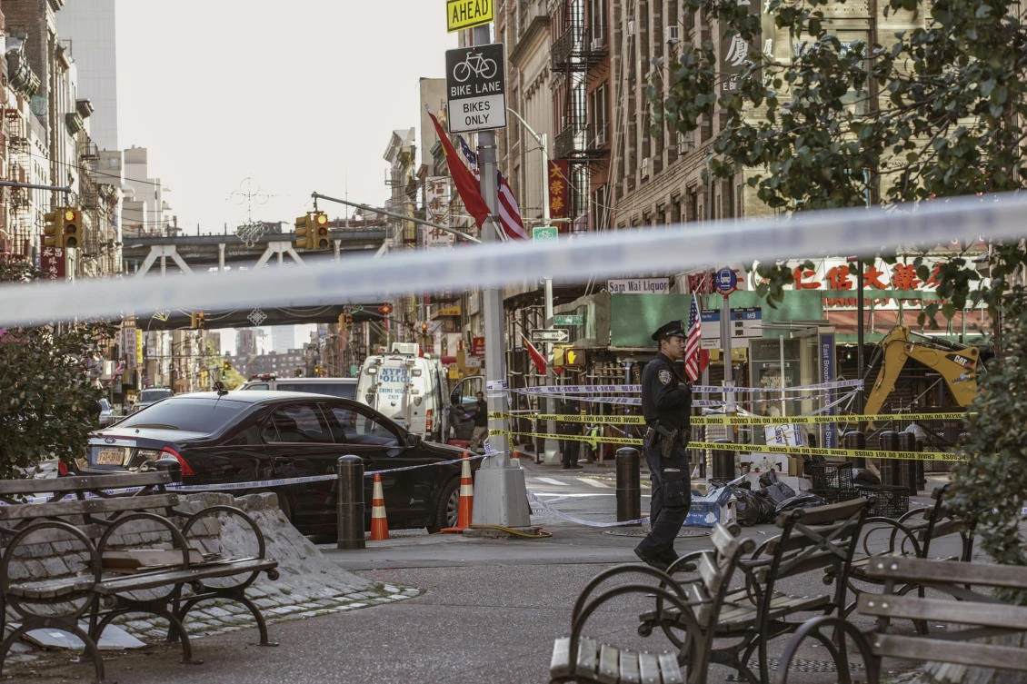 New York Police Department officers investigate the scene of an attack in Manhattan’s Chinatown neighborhood, Saturday, Oct. 5, 2019 in New York. (AP)
