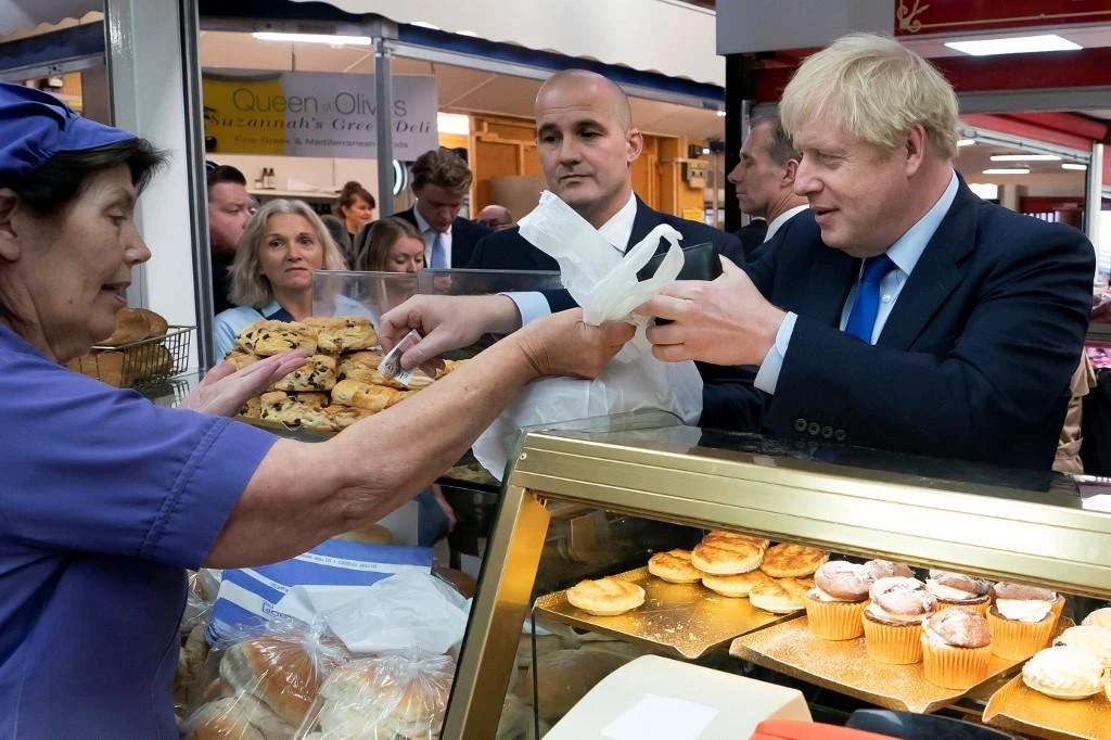 The British opposition warned that Boris Johnson’s supporters could be pressing the prime minister for a no-deal Brexit in order to benefit their currency market positions. (AFP)