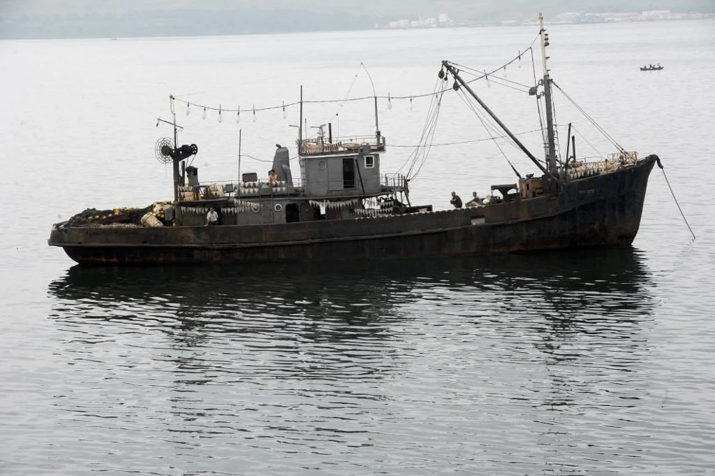Some North Korean fishermen are traveling far out to sea in order to satisfy government mandates for bigger catches. (AFP file photo)