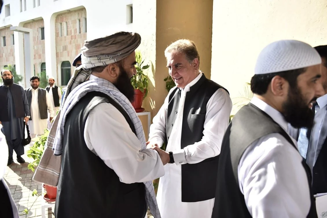 In this handout photograph taken and released by the Pakistan Foreign Ministry on October 3, 2019, Pakistan's Foreign Minister Shah Mehmood Qureshi (centre R) receives members of the Taliban delegation at the Pakistan Foreign Ministry in Islamabad. (AFP)