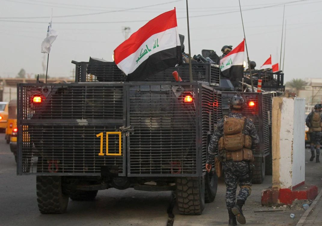 Iraqi police are seen deployed in Baghdad's predominantly Shiite Sadr City, on October 7, 2019. (AFP)