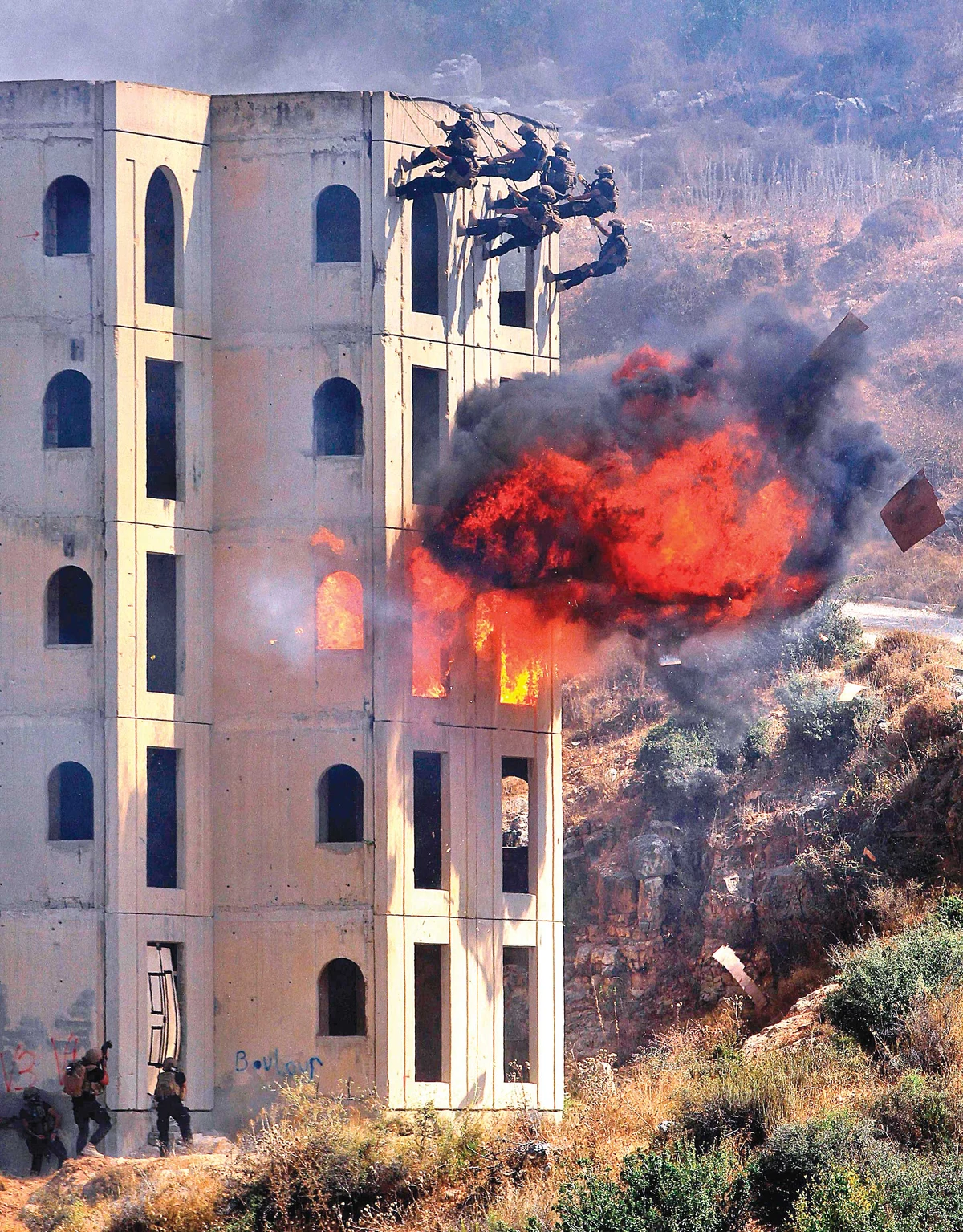 Lebanese security forces take part in a drill, simulating a chemical weapons attack in Kfar Falous on Tuesday. (AFP)
