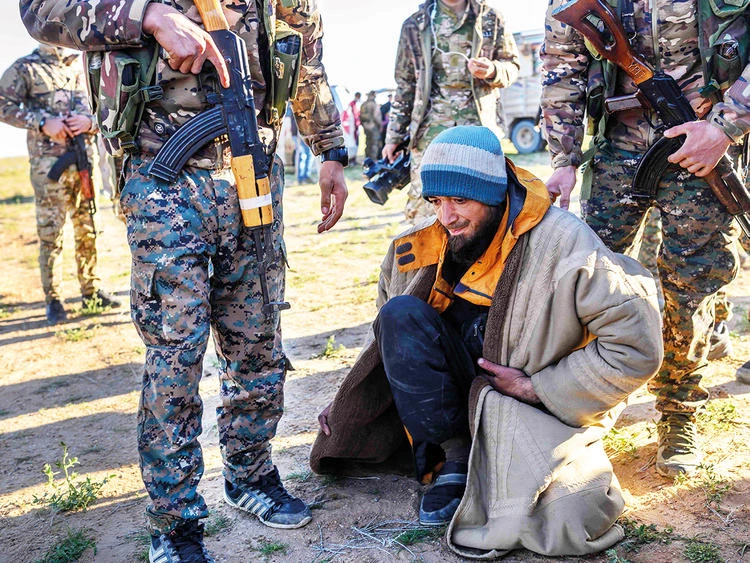 A Daesh fighter of Bosnian origin surrenders to Kurdish-led Syrian Democratic Forces in Syria’s northern Deir Ezzor province. (AFP)