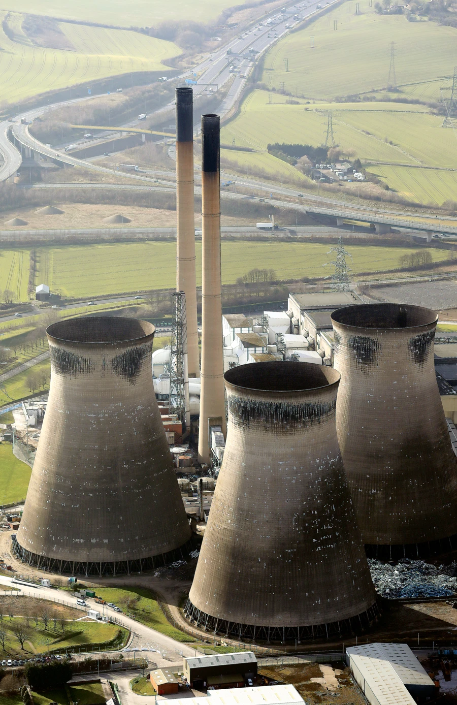 Ferrybridge power station in the UK. Some companies’ profits may shrink faster than others as governments prioritize low-carbon energy. (Shutterstock)