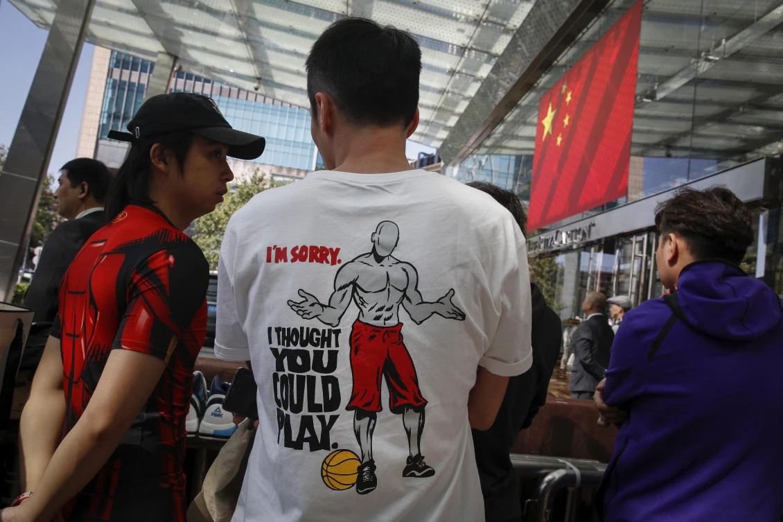 The intense Chinese backlash against the NBA over its attitudes on free speech and Hong Kong’s democracy movement has thrown the games into doubt. Above, Chinese fans wait for Brooklyn Nets and Los Angeles Lakers players on Wednesday, October 9. (AP)